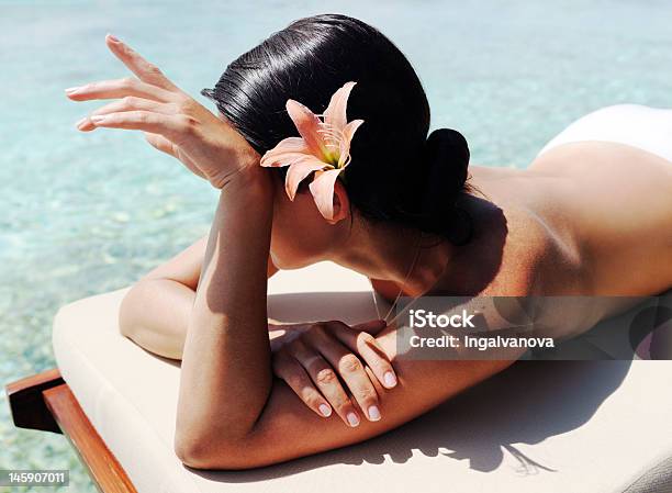 Beautiful Woman Taking Sunbath Stock Photo - Download Image Now - Rear View, Back, Tourist Resort