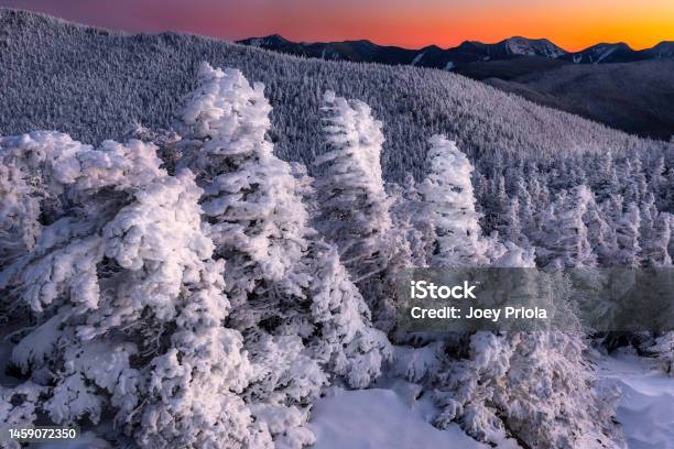 A Beautiful Winter Sunset From Cascade Mountain In The Adirondack Mountains With Snowy Trees And Colorful Sky Stock Photo - Download Image Now
