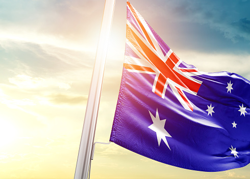 Australia waving flag in beautiful sky.