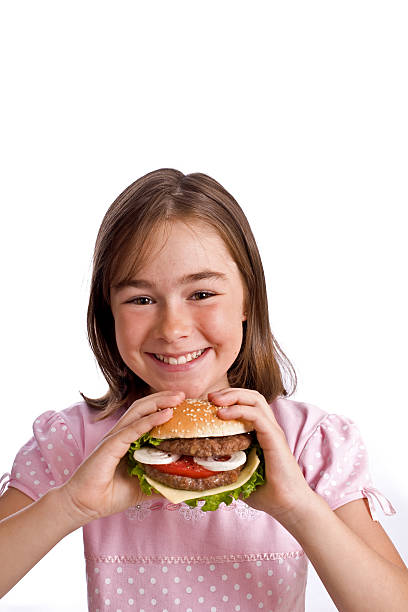 istock Girl eating hamburger 145907778