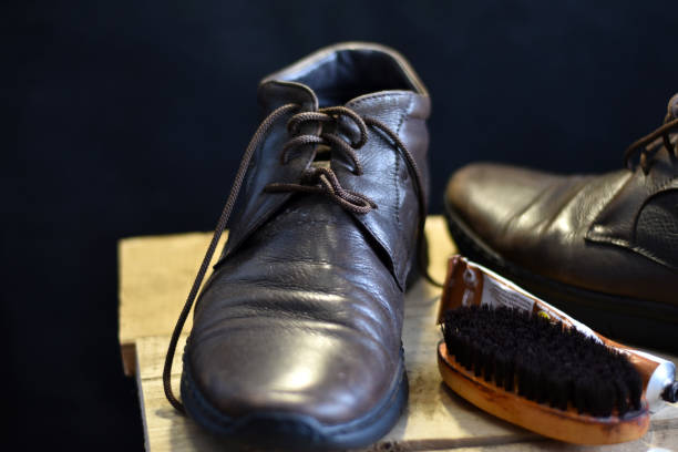 istock Old leather shoe and shoe brush. 1459080770