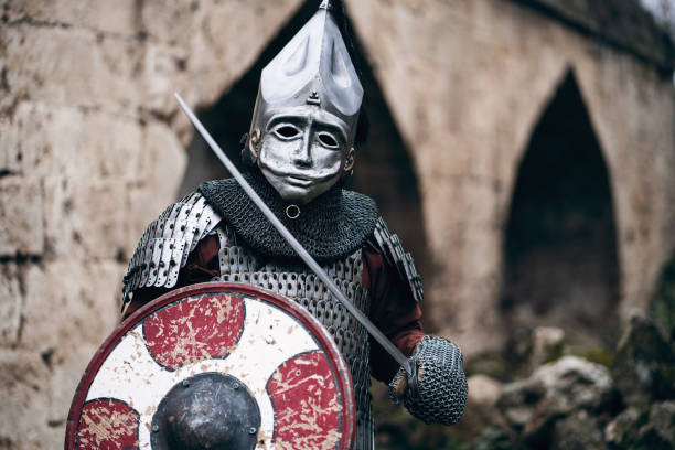 istock Unrecognizable medieval warrior with a helmet, sword and shield 1459081517