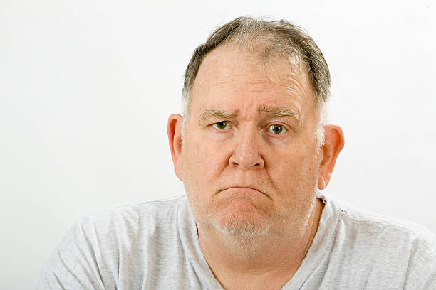 Grumpy big guy stock photo