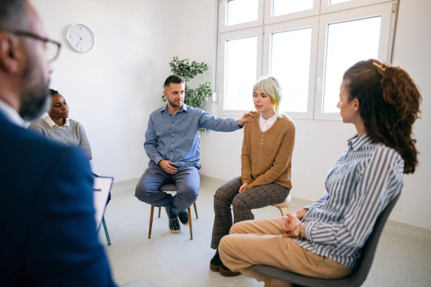 istock Woman sharing her emotions during group therapy 1459084128