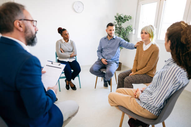 istock Woman sharing her emotions during group therapy 1459084163