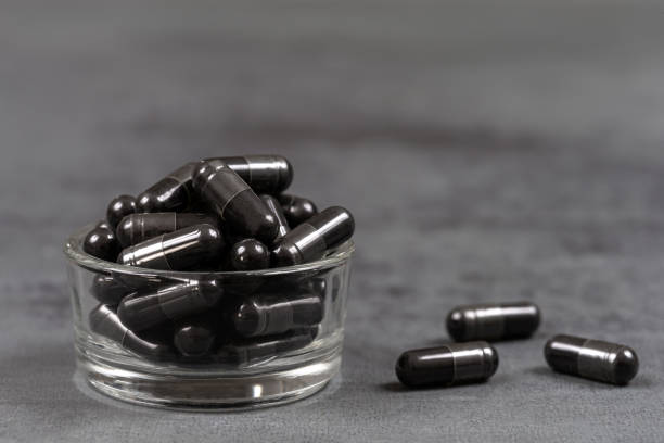 istock Vegetable charcoal capsules Organic-Food supplement 1459084591