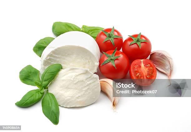 Mozzarella Tomatoes Basil And Garlic Stock Photo - Download Image Now - Tomato, Mozzarella, Basil