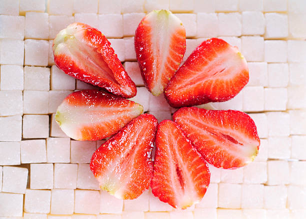 Sugar background with strawberry stock photo