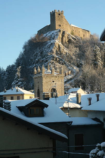 istock Castle on hill top covered in snow overlooking town 145908690