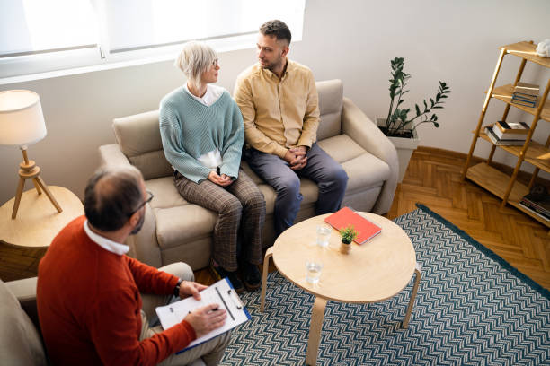 istock Caucasian couple having relationship counseling with therapist 1459087674
