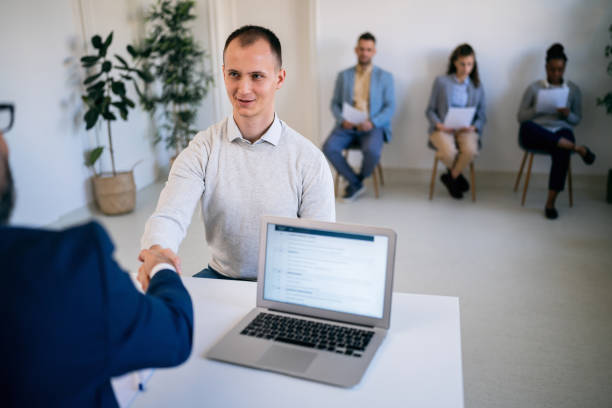 istock Male candidate handshake with the recruiter at job interview 1459087717