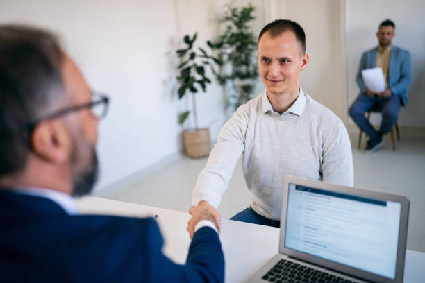 istock Male candidate handshake with the recruiter at job interview 1459087728