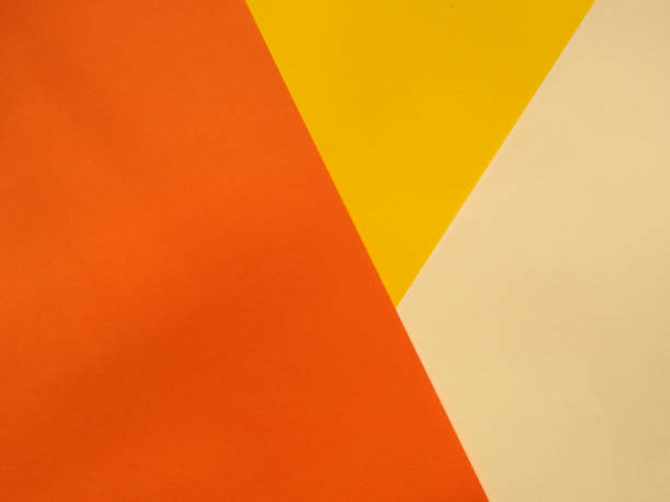 istock Yellow, beige and orange color paper, abstract background 1459089946