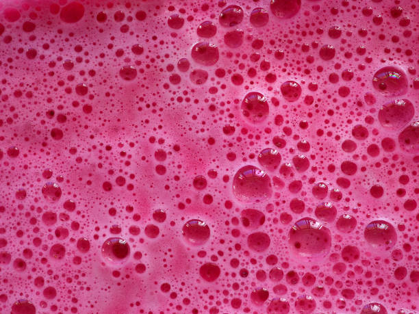 istock Magenta colorful bath foam with bubbles in the water. 1459090117