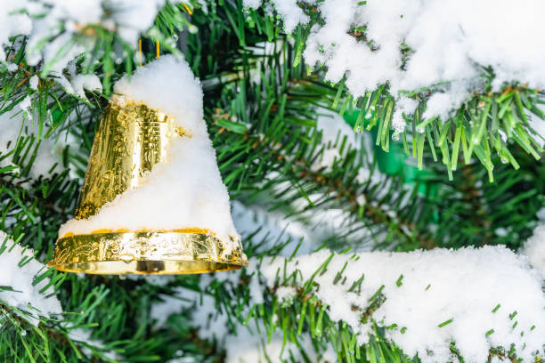 istock Christmas decorations hanging on a pine tree with glitter, 1459090477