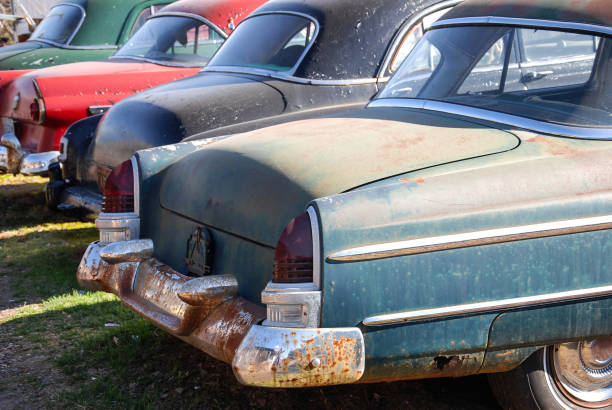 Old rusty destroyed car covered with rust, vintage car.
