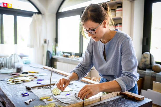 istock Glass artist craftswoman working in her studio 1459094595