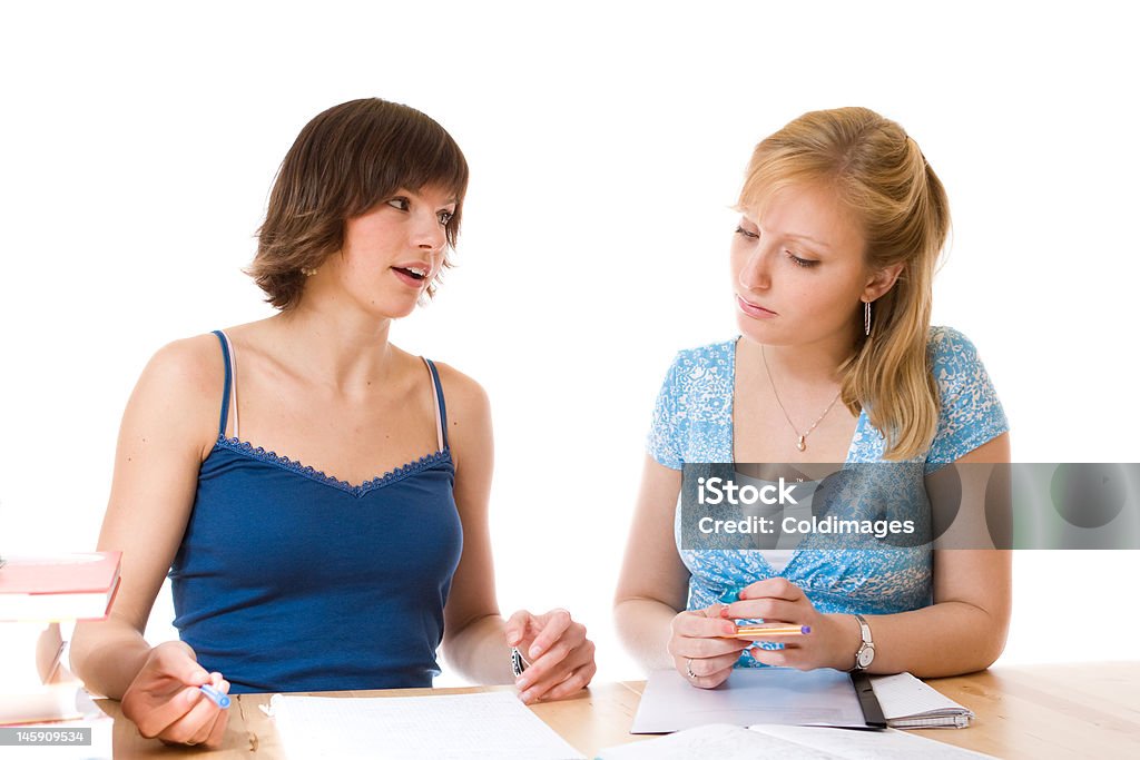 Students Two female students helping eachother Discussion Stock Photo