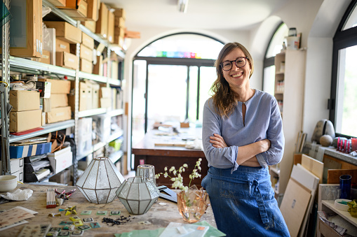 Glass artist craftswoman working in her studio