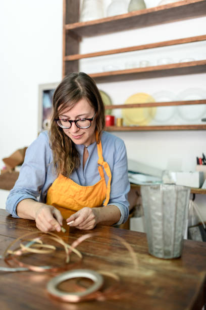 istock Glass artist craftswoman working in her studio 1459097375