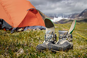 Trekking boots are drying in the mountain camp.