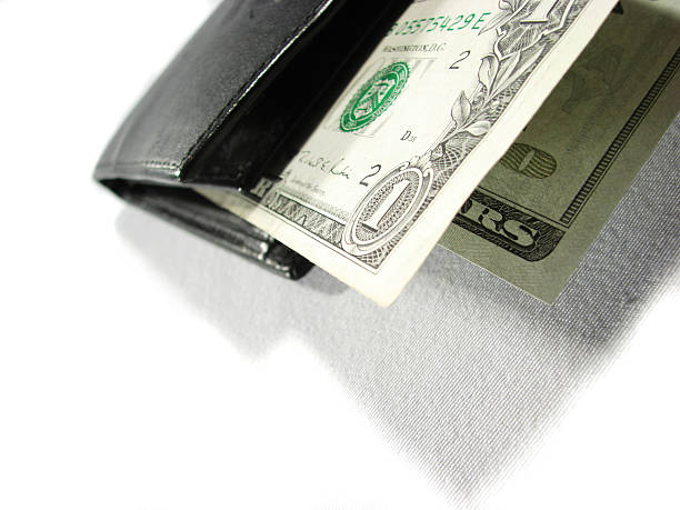 Bolsa em couro Preto com papel dinheiro dólares dois - fotografia de stock