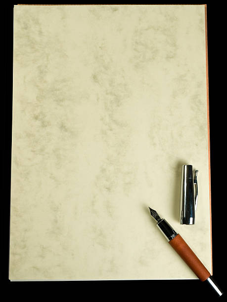 istock Wooden pen on old paper sheets 145911122