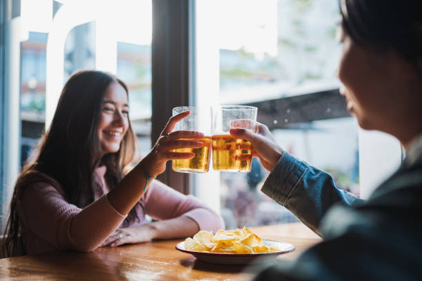 istock Two young women toasting 1459111553