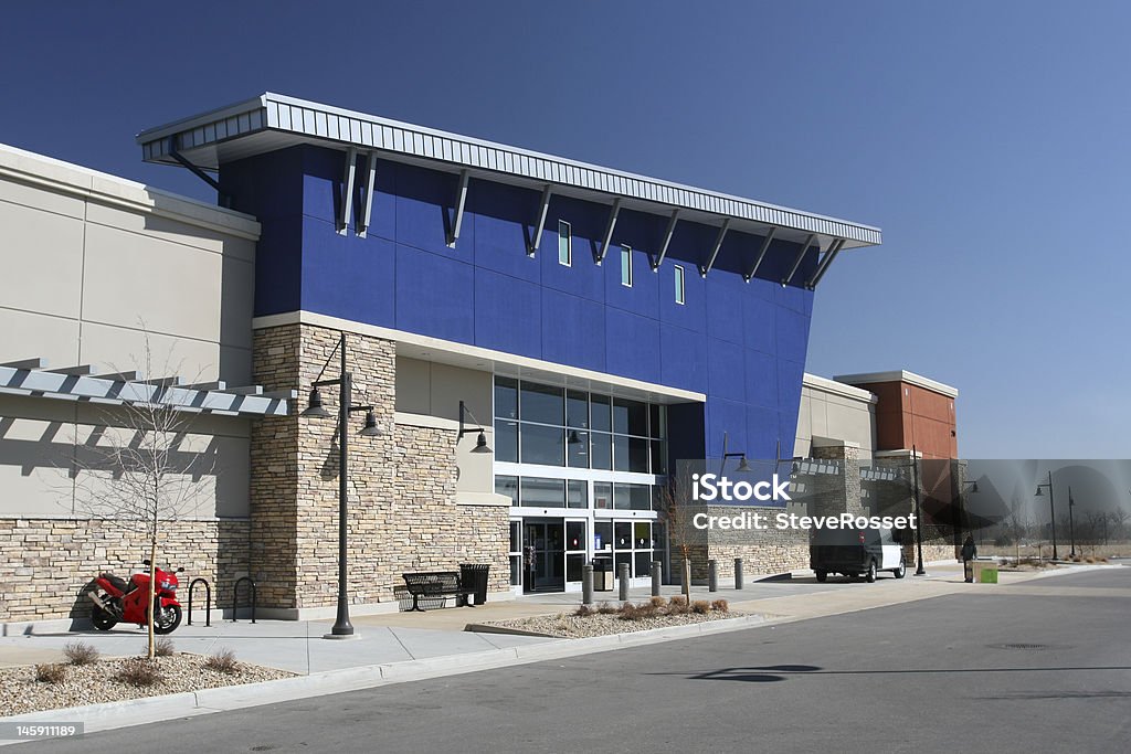 Modern American Strip Center Newly built retail strip center with large anchor store. Store Stock Photo