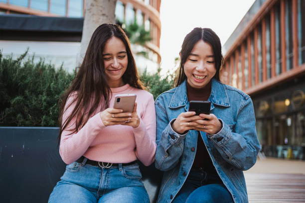 istock Two girls friends having fun 1459113624