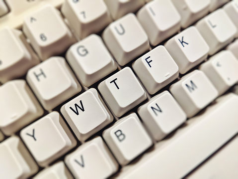 Photo of a retro style keyboard with keys in focus rearranged to read 