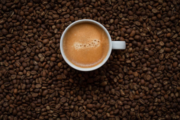 Coffee Coffee cup and coffee beans cappuccino coffee froth milk stock pictures, royalty-free photos & images