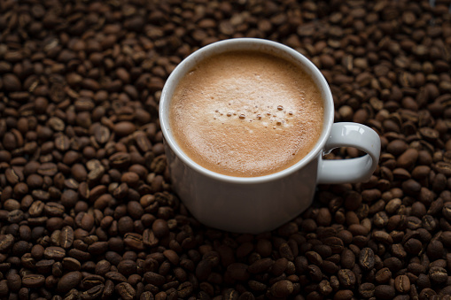 Coffee cup and coffee beans