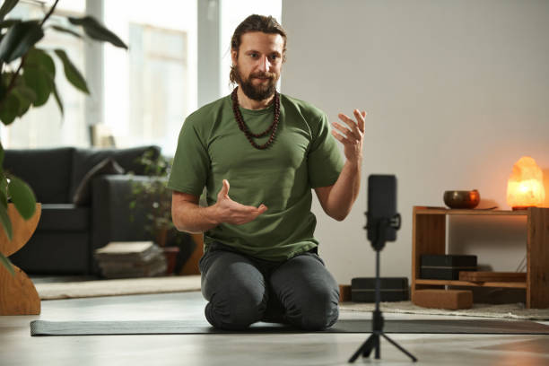 istock Man communicating with his followers during online broadcast 1459119896