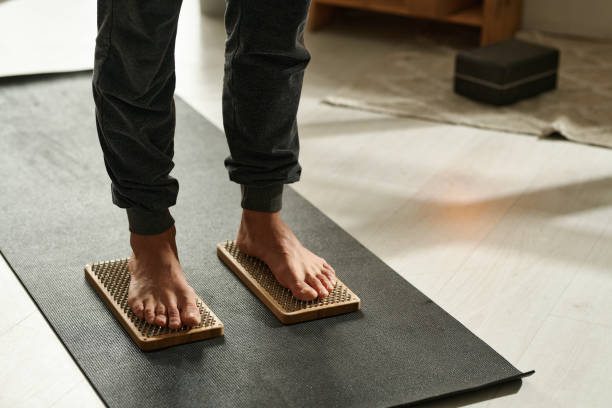 istock Yoga man practicing to stand on nails 1459122763