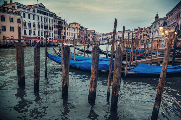 istock Gondolas on a canal in Venice in Italy 1459124356