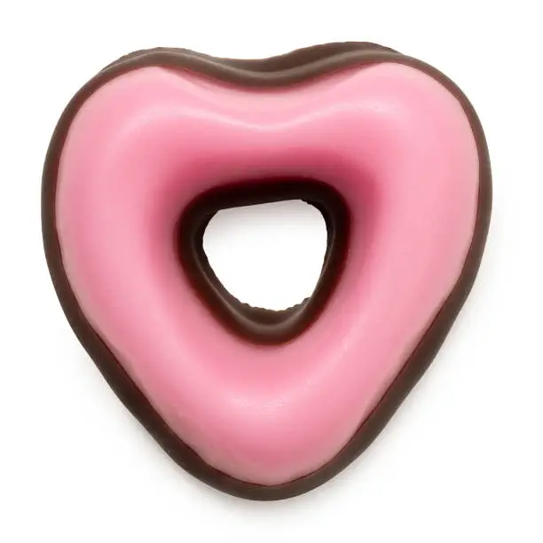 Pink christmas fondant sweet dipped in chocolate isolated on white. Top view.