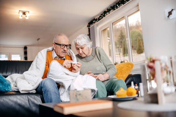 istock Old couple having flu at home 1459129761