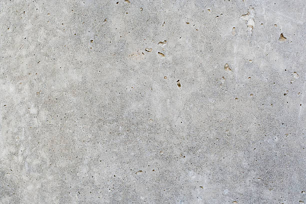 istock Gray concrete wall with small holes 145913238