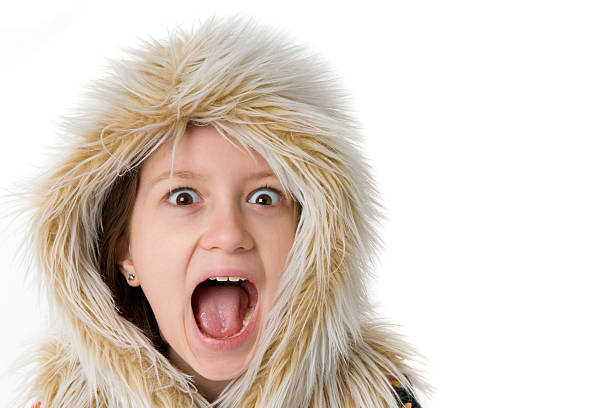 Young girl in fur hood stock photo