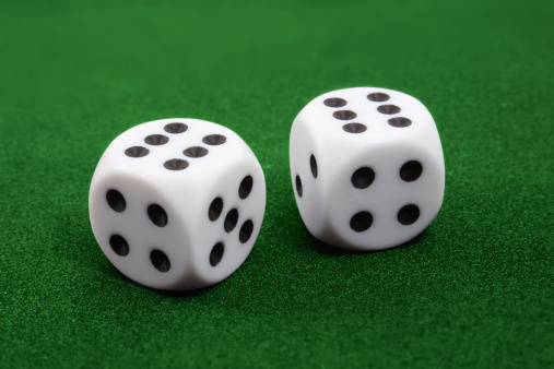 Two dices on green surface. Two six