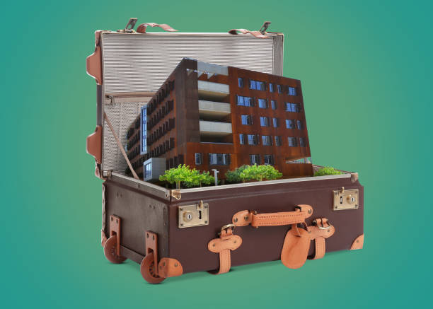 istock Building in retro suitcase on green background 1459133131