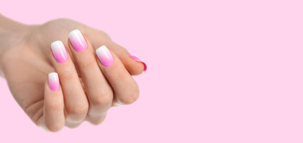 istock Womans hands with trendy manicure on pink background 1459134783