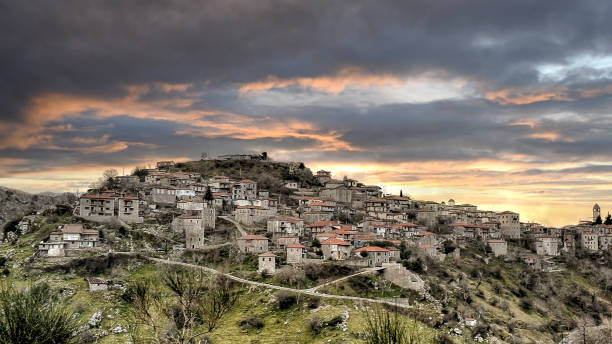 mountain village named Dimitsana at sunset. Panoramic view of a beautiful mountain village named Dimitsana at sunset. Peloponesse, Greece. arachova greece stock pictures, royalty-free photos & images