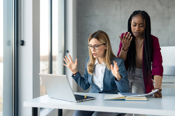 istock Two multiethnic frustrated business women feeling disappointed over failure at work 1459136480