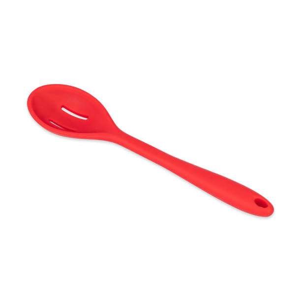 istock Red silicon spoon isolated over white background 1459137239