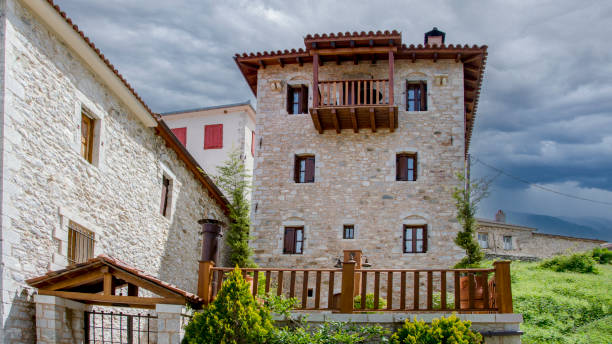 stone houses in Valtessiniko village Beautiful traditional architecture on those stone houses in Baltessiniko village. Arcadia, Peloponnese, Greece arachova greece stock pictures, royalty-free photos & images