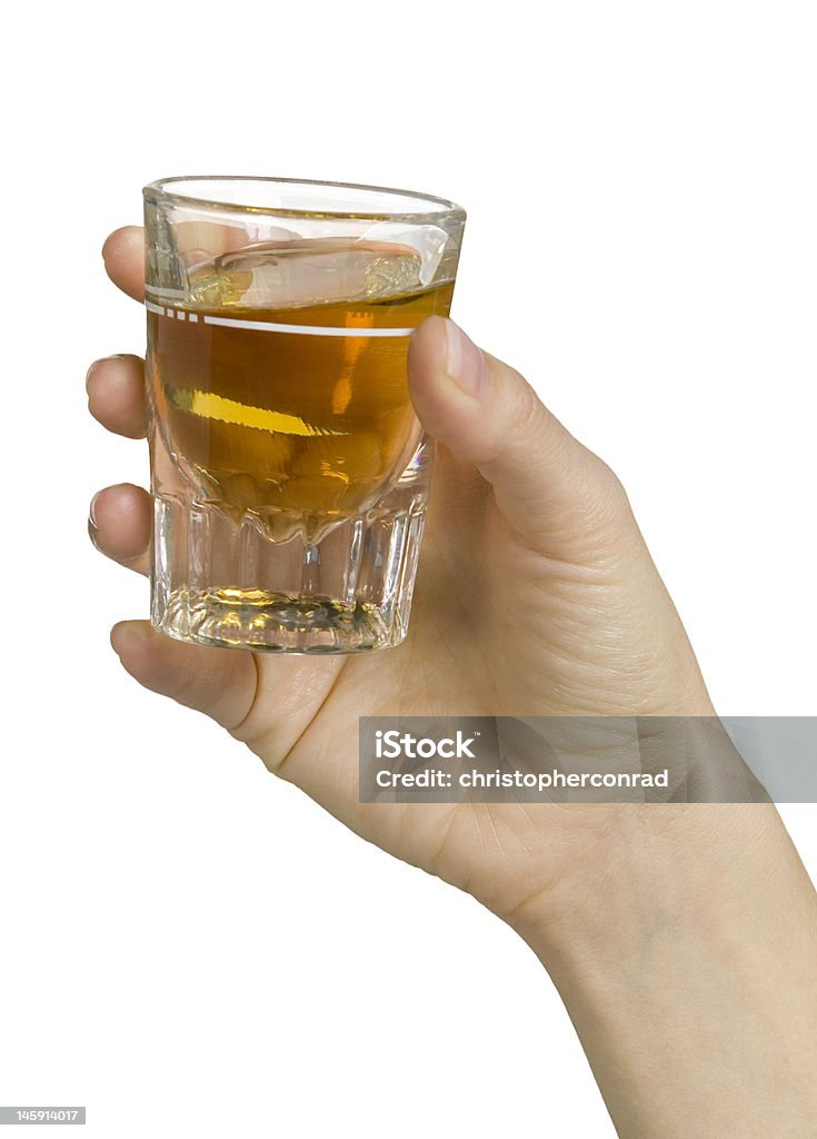 Shot of whiskey shot glass of whiskey in woman's hand Drinking Stock Photo