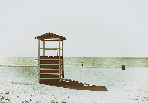 lifeguard kiosk at the beach. old fashioned style photography.