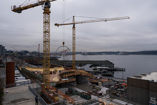 Seattle, USA - Nov 28, 2022: Construction on the waterfront in downtown below Pike Place Market late in the day.